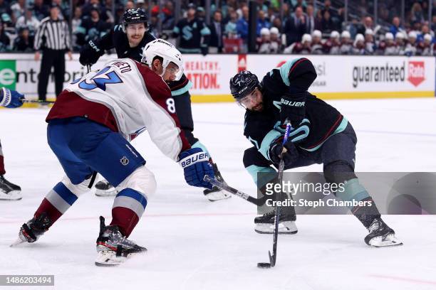 Jordan Eberle of the Seattle Kraken skates against Matt Nieto of the Colorado Avalanche during the second period in Game Six of the First Round of...