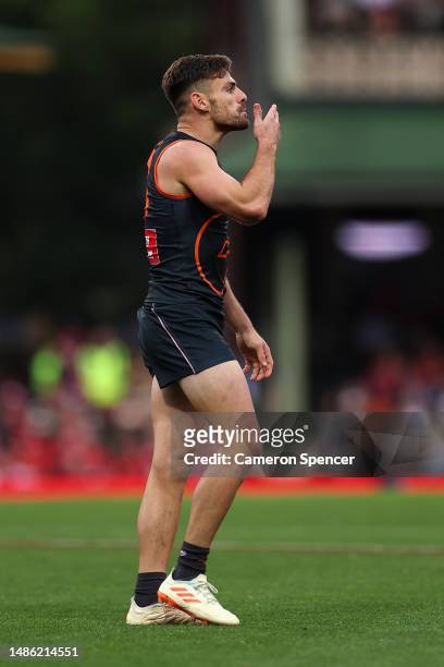 Stephen Coniglio of the Giants celebrates kicking a goal during the round seven AFL match between Sydney Swans and Greater Western Sydney Giants at...