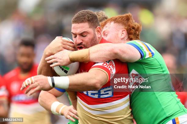 Nolan Stringer Brenko Lee of the Dolphins is tackled during the round nine NRL match ...