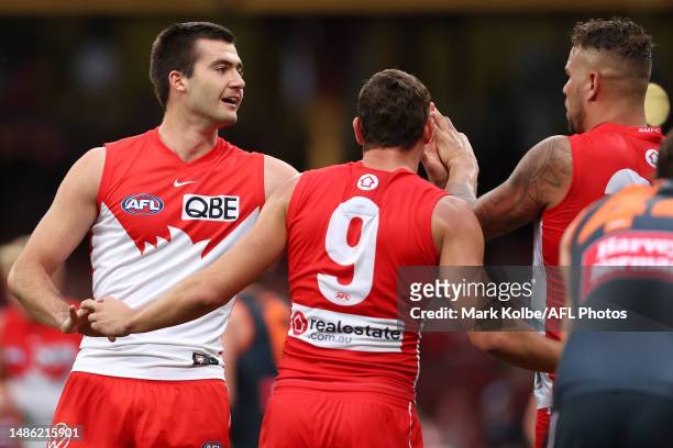 Logan McDonald of the Swans celebrates with his team mates after kicking a goal during the round seven AFL match between Sydney Swans and Greater...