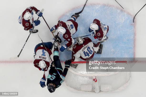 Jack Johnson of the Colorado Avalanche shoves Matty Beniers of the Seattle Kraken third period in Game Six of the First Round of the 2023 Stanley Cup...