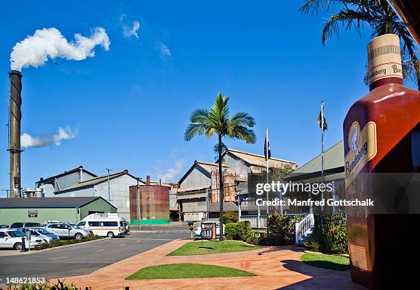 huge rum bottle at the museum of the bundaberg rum distillery. - バンダバーグ ストックフォトと画像