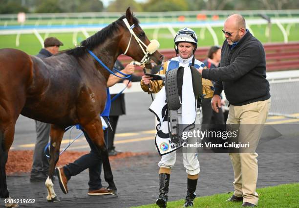 Luke Nolen is assisted by trainer Peter Moody after riding Do Ya Punk in Race 7, the Manhari Metals Handicap, during Melbourne Racing at Sandown...