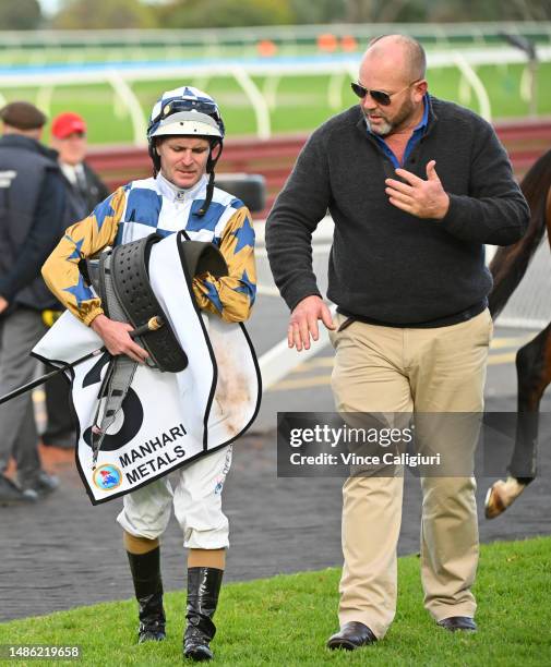 Luke Nolen is assisted by trainer Peter Moody after riding Do Ya Punk in Race 7, the Manhari Metals Handicap, during Melbourne Racing at Sandown...