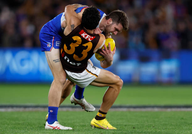Tyler Brockman of the Hawks tackles Bailey Williams of the Bulldogs during the round seven AFL match between Western Bulldogs and Hawthorn Hawks at...