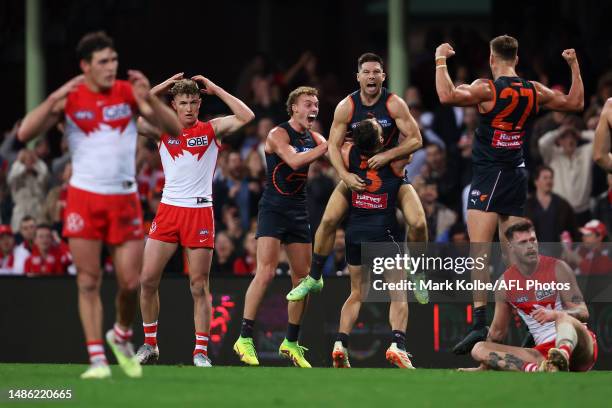 Toby Greene of the Giants celebrates with his team mates after kicking a goal during the round seven AFL match between Sydney Swans and Greater...