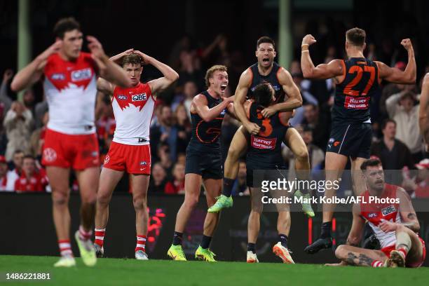 Toby Greene of the Giants celebrates with his team mates after kicking a goal during the round seven AFL match between Sydney Swans and Greater...