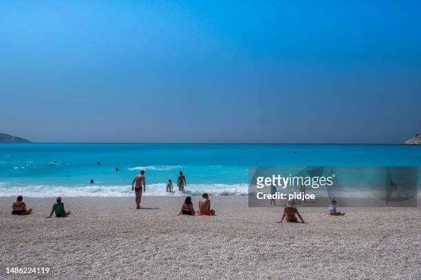 enjoying the sea in kefalonia, greece - sandbar stock pictures, royalty-free photos & images