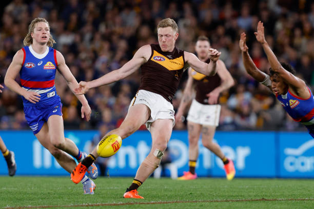 James Sicily of the Hawks kicks a goal during the round seven AFL match between Western Bulldogs and Hawthorn Hawks at Marvel Stadium, on April 29 in...