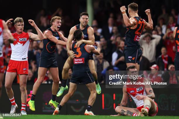 Toby Greene of the Giants celebrates with his team mates after kicking a last minute goal to give the Giants the lead during the round seven AFL...