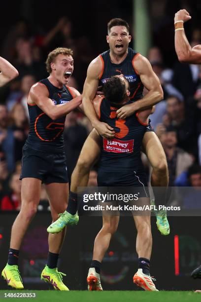 Toby Greene of the Giants celebrates with his team mates after kicking a last minute goal to give the Giants the lead during the round seven AFL...