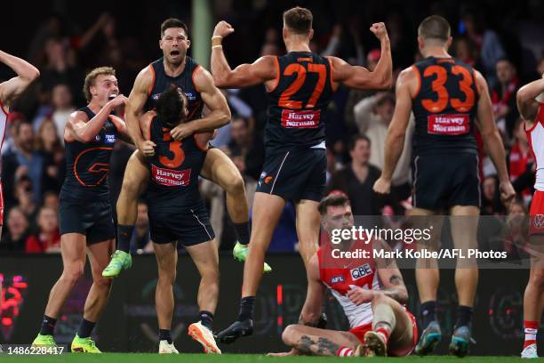 Toby Greene of the Giants celebrates with his team mates after kicking a last minute goal to give the Giants the lead during the round seven AFL...