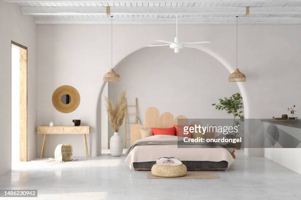 modern bedroom interior with double bed, wicker lamps, red pillows and potted plant - cabeceira da cama imagens e fotografias de stock