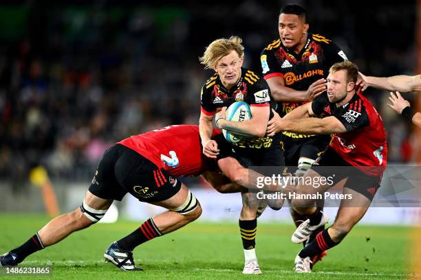 Damian McKenzie of the Chiefs charges forward during the round 10 Super Rugby Pacific match between Chiefs and Crusaders at FMG Stadium Waikato, on...