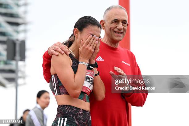 Maria Fernanda Montoya of Colombia reacts after crossing the finish line in the Women's 21.1km Race during the Adizero: Road To Records 2023 on April...