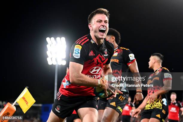 Fergus Burke of the Crusaders celebrates after scoring a try during the round 10 Super Rugby Pacific match between Chiefs and Crusaders at FMG...