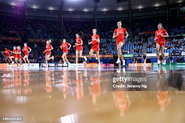 The Sydney Swifts warm up prior to the round seven Super Netball match between Giants Netball and NSW Swifts at Ken Rosewall Arena, on April 29 in...