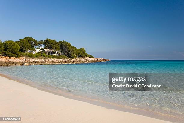 waters of cala agulla to punta des gullo. - spain beach stock pictures, royalty-free photos & images