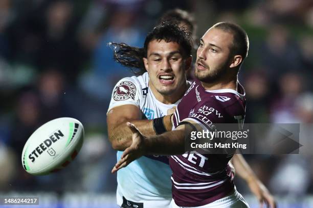 Karl Lawton of the Sea Eagles offloads the ball in a tackle during the round nine NRL match between Manly Sea Eagles and Gold Coast Titans at 4 Pines...