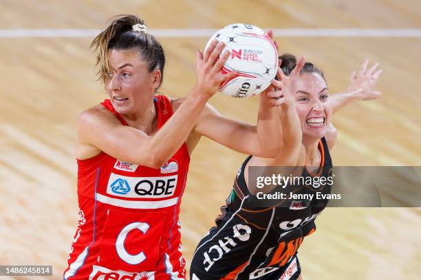 Maddy Proud of the Swifts looks to pass as Amy Parmenter of the Giants defends during the round seven Super Netball match between Giants Netball and...