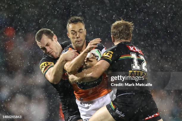 Luke Brooks of the Wests Tigers is tackled during the round nine NRL match between Penrith Panthers and Wests Tigers at Carrington Park on April 29,...