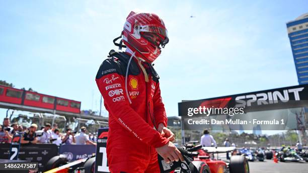 Pole position qualifier Charles Leclerc of Monaco and Ferrari looks on in parc ferme during the Sprint Shootout ahead of the F1 Grand Prix of...