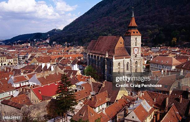 overhead of black church and medieval houses, transylvania. - brasov romania stock pictures, royalty-free photos & images