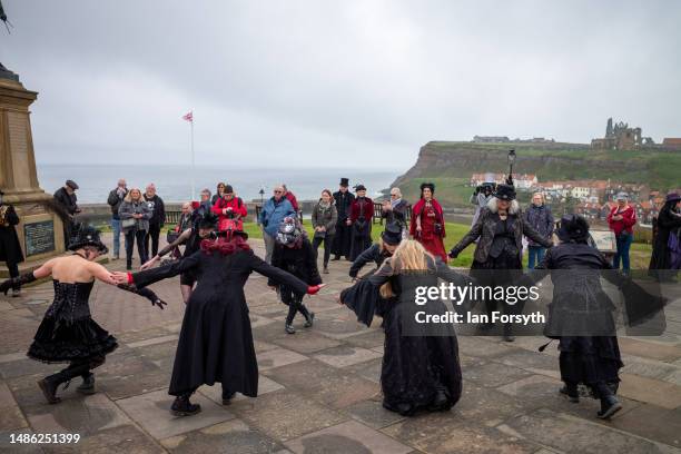 Goth folk dancers perform during the Whitby Goth Weekend on April 29, 2023 in Whitby, England. The original Whitby Goth Weekend event started in 1994...