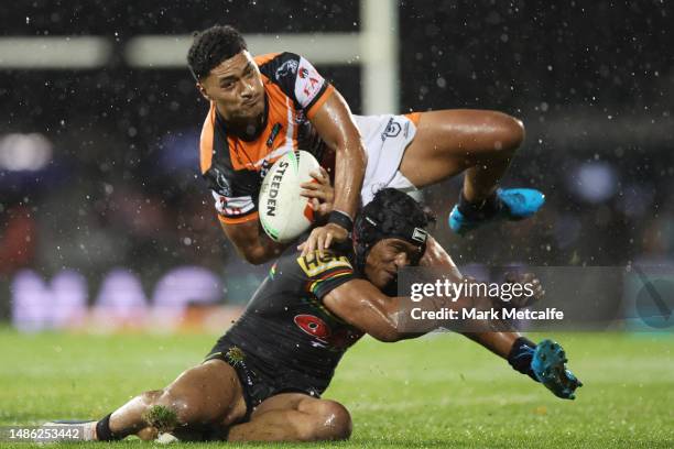 Junior Tupou of the Wests Tigers is tackled by Brian To'o of the Panthers during the round nine NRL match between Penrith Panthers and Wests Tigers...