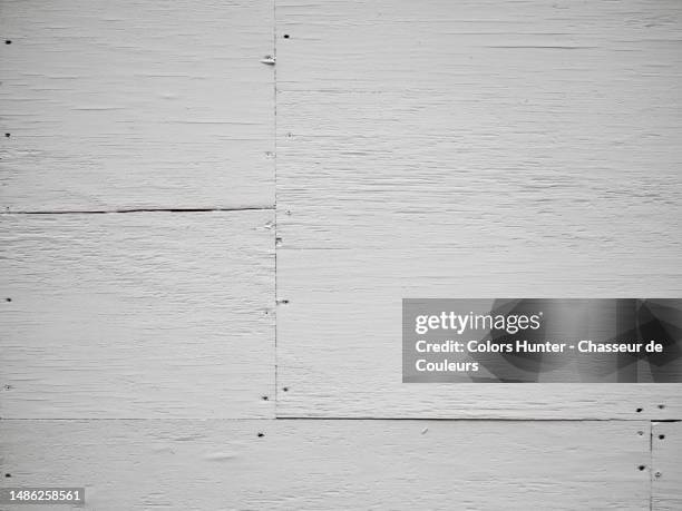 empty wooden panels painted white with a rough texture in midtown manhattan, new york, usa - newly industrialized country stock pictures, royalty-free photos & images