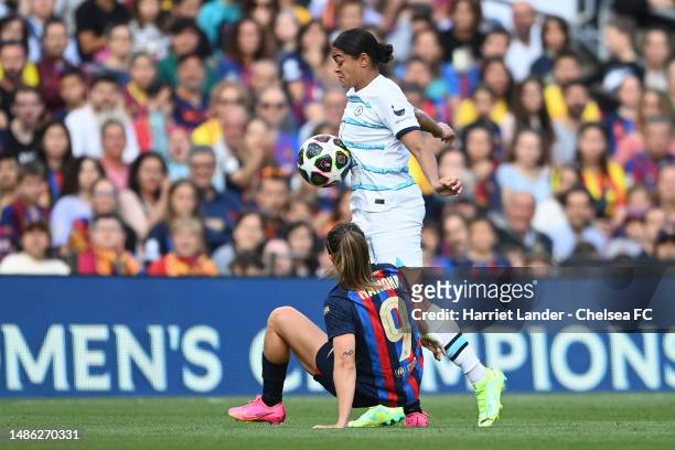 Jess Carter of Chelsea is challenged by Mariona Caldentey of Barcelona during the UEFA Women's Champions League semifinal 2nd leg match between FC...