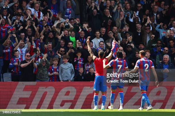 Crystal Palace fans celebrate the teams first goal scored by Jordan Ayew of Crystal Palace during the Premier League match between Crystal Palace and...