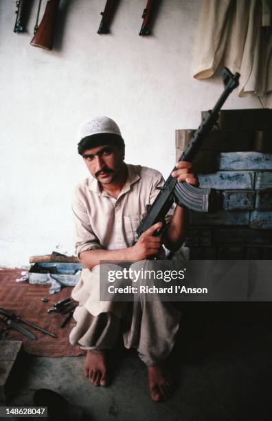 copies of kalishnikovs and all sorts of other guns can be bought from the gun dealers of darra adam khel - darra adam khel stock pictures, royalty-free photos & images