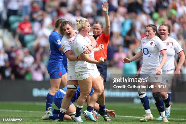 Marlie Packer of England celebrates with teammate Sarah Beckett after scoring the team's second try during the TikTok Women's Six Nations match...