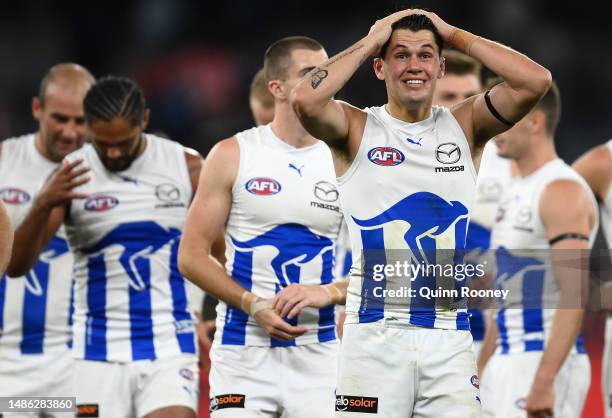 The Kangaroos look dejected after losing the round seven AFL match between Melbourne Demons and North Melbourne Kangaroos at Melbourne Cricket...