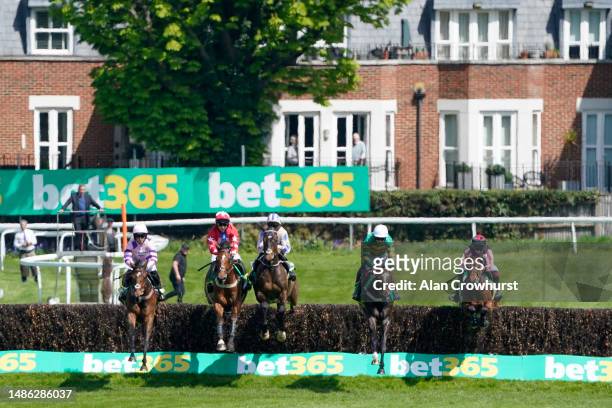 Aidan Coleman riding Jonbon clear the first fence before going on to win The bet365 Celebration Chase at Sandown Park Racecourse on April 29, 2023 in...