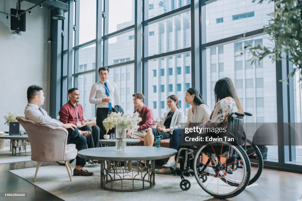 Diversify Asian seminar participants casual chat after successful conference event at lounge