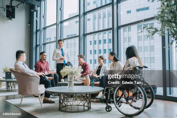 diversify asian seminar participants casual chat after successful conference event at lounge - disabled accessibility stock pictures, royalty-free photos & images