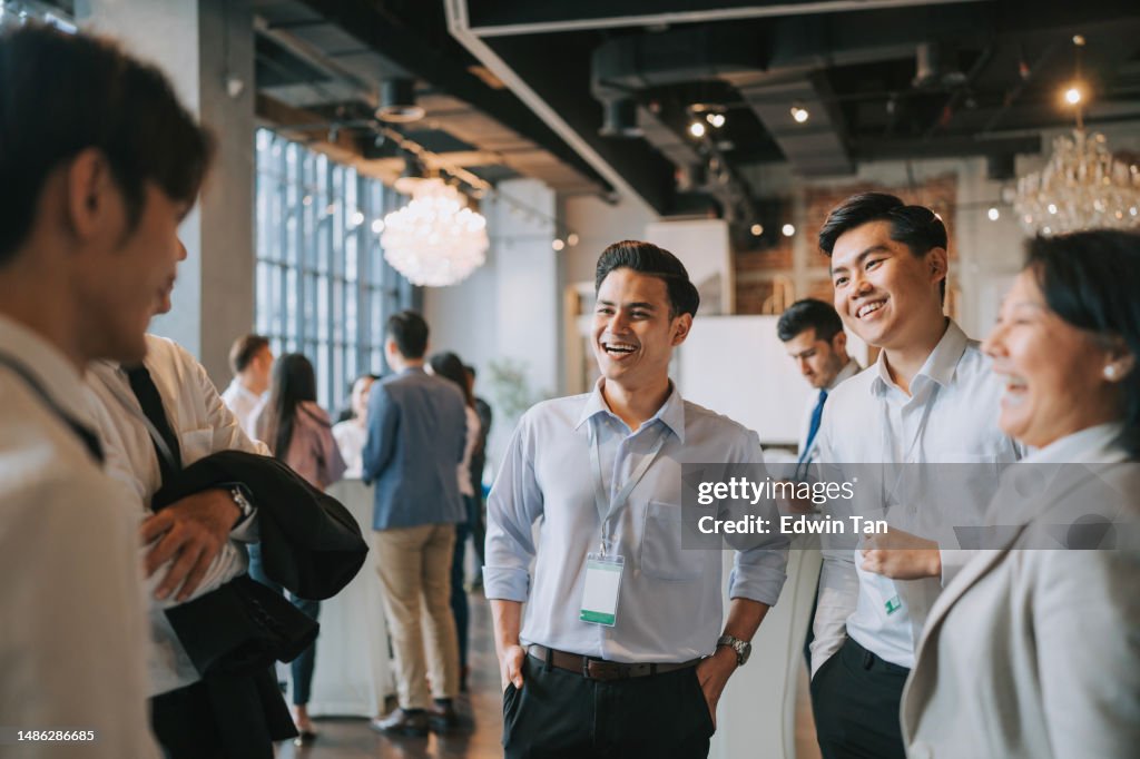 Diversify Asian seminar participants casual chat after successful conference event at lounge