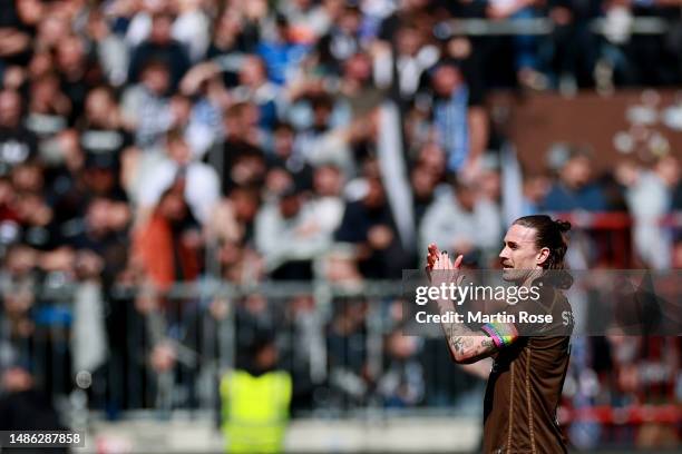 Jackson Irvine of FC St. Pauli applauds fans after the Second Bundesliga match between FC St. Pauli and DSC Arminia Bielefeld at Millerntor Stadium...