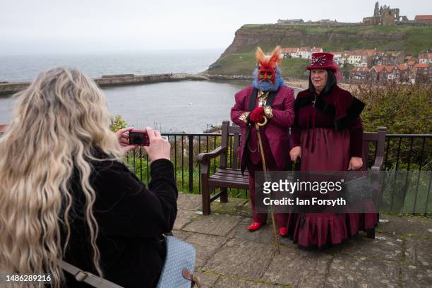 Couple in costume pose for a picture during the Whitby Goth Weekend on April 29, 2023 in Whitby, England. The original Whitby Goth Weekend event...