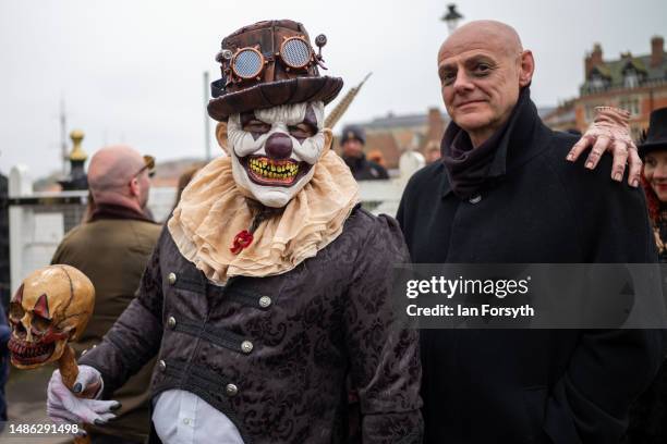 Two men in costume walk across Whitby swing bridge during the Whitby Goth Weekend on April 29, 2023 in Whitby, England. The original Whitby Goth...