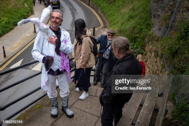 Man in costume climbs the steps to west cliff during the Whitby Goth Weekend on April 29, 2023 in Whitby, England. The original Whitby Goth Weekend...