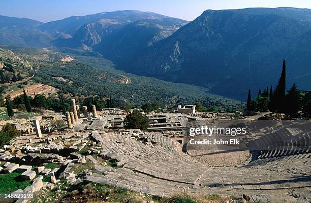 view of the theatre looking and valley at the 4th century b.c. sanctuary of apollo. - delphi stock pictures, royalty-free photos & images