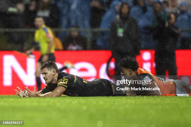 Nathan Cleary of the Panthers reacts after a tackle by Jahream Bula of the Wests Tigers prevented a try during the round nine NRL match between...