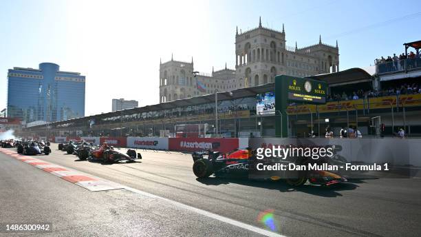 Max Verstappen of the Netherlands driving the Oracle Red Bull Racing RB19 leads George Russell of Great Britain driving the Mercedes AMG Petronas F1...