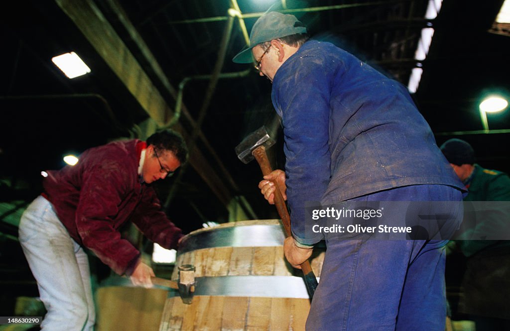 Men making wine barrels.