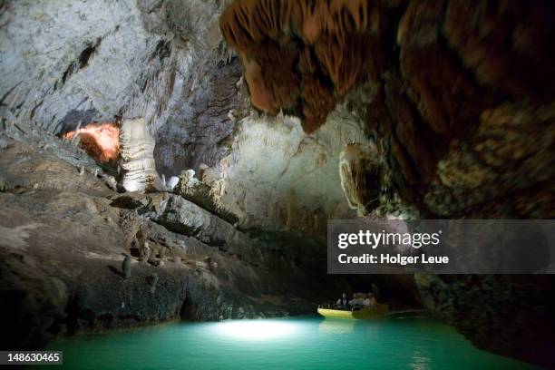 boat in jeita grotto. - grotto stock pictures, royalty-free photos & images