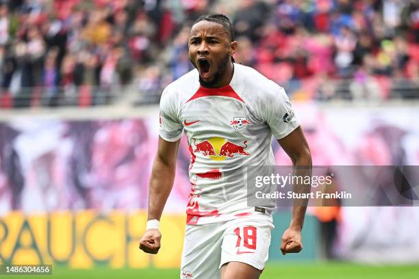 Christopher Nkunku of RB Leipzig celebrates after scoring their sides first goal during the Bundesliga match between RB Leipzig and TSG Hoffenheim at...