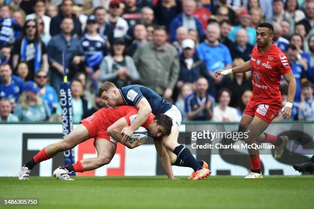 Garry Ringrose of Leinster tackles Juan Cruz Mallia of Stade Toulousain during the Heineken Champions Cup Semi Final between Leinster Rugby and Stade...